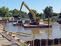 Cleaning sediment at Camp Marina manufactured gas plant site in 2011