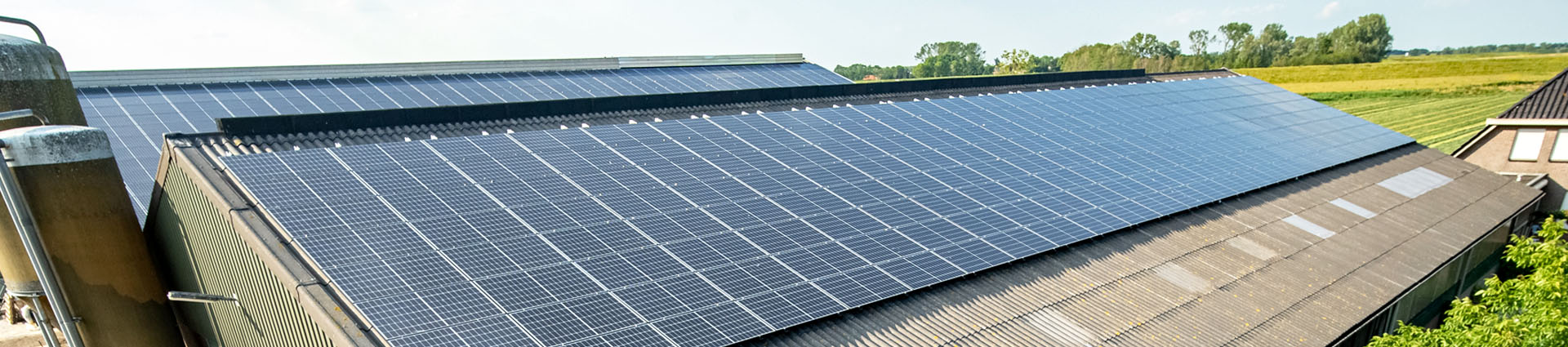 solar panels on large metal farm structure roof