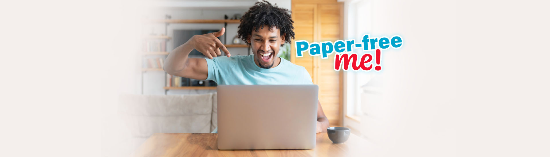 happy african american man pointing at laptop