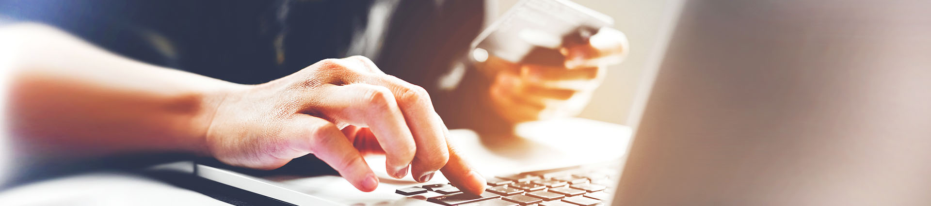 person paying bill with laptop